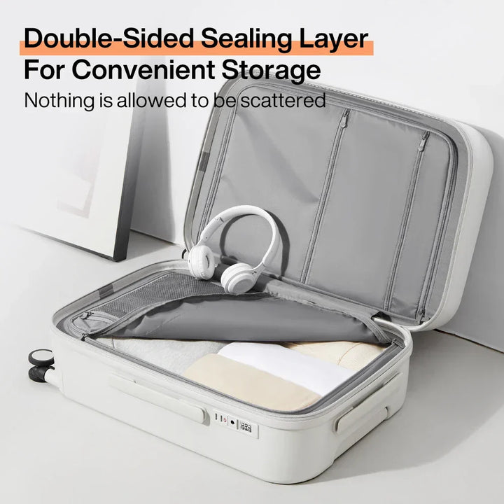 Close-up of the robust telescopic handle and multi-directional spinner wheels on a durable travel bag.