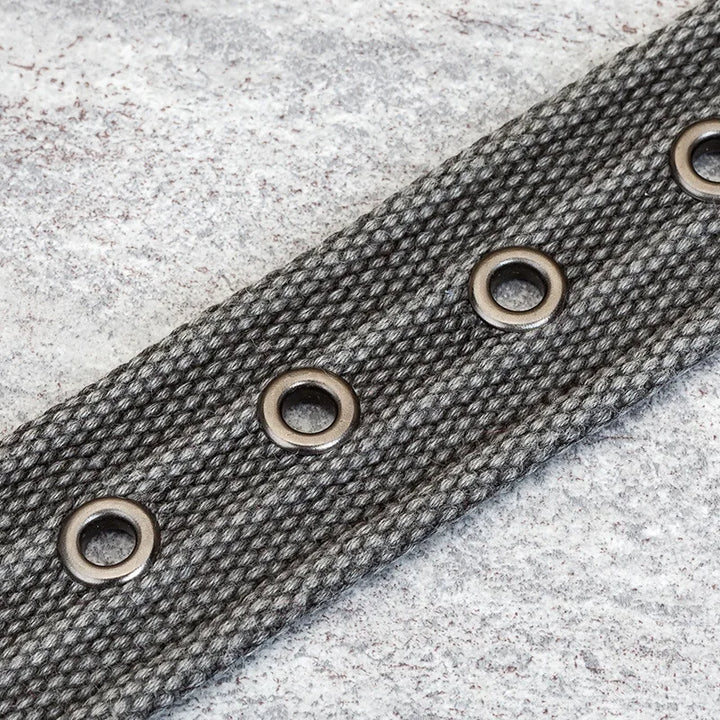 Men's durable woven fabric belt with premium leather trim and polished metal buckle. Essential accessory.