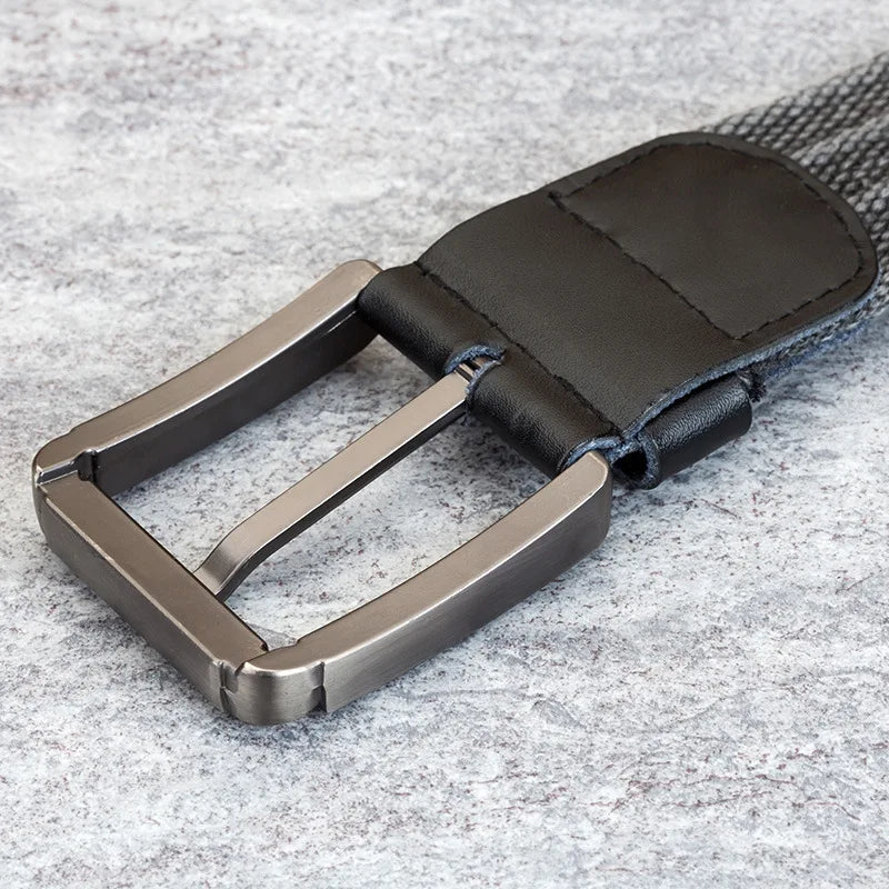 Men's stylish woven belt with leather accents & sturdy buckle. A durable, adjustable fashion accessory.