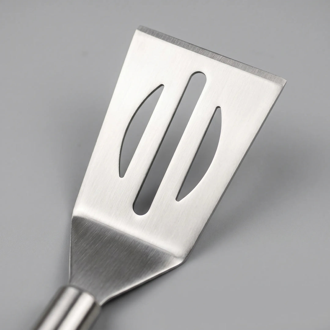 Essential stainless steel BBQ grilling tool kit, perfect for outdoor cooking, includes tongs, spatula, fork, and storage case.
