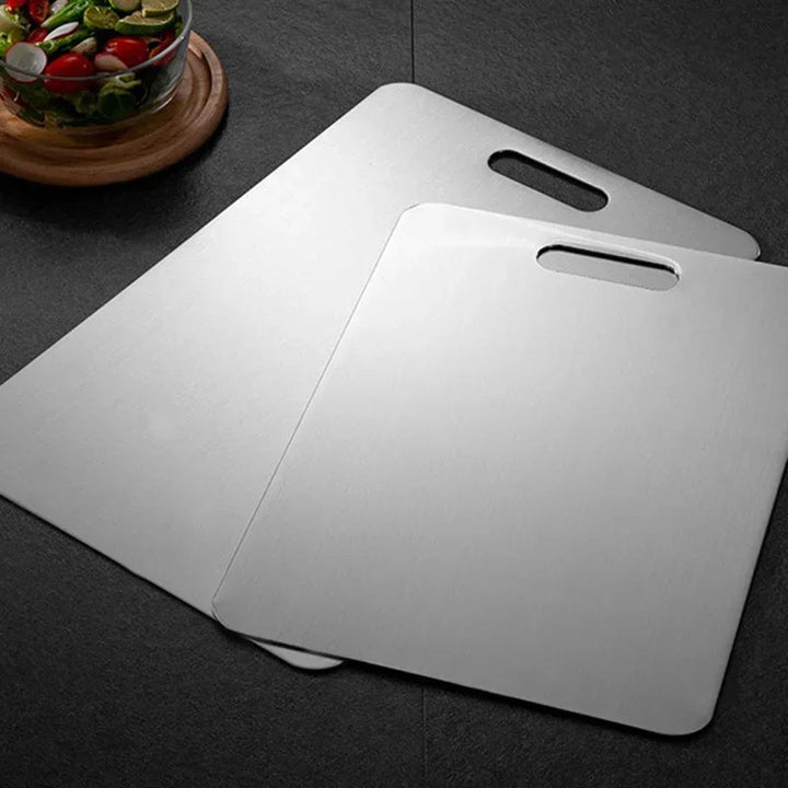 Durable stainless steel cutting board for hygienic kitchen food prep. Non-porous chopping surface.