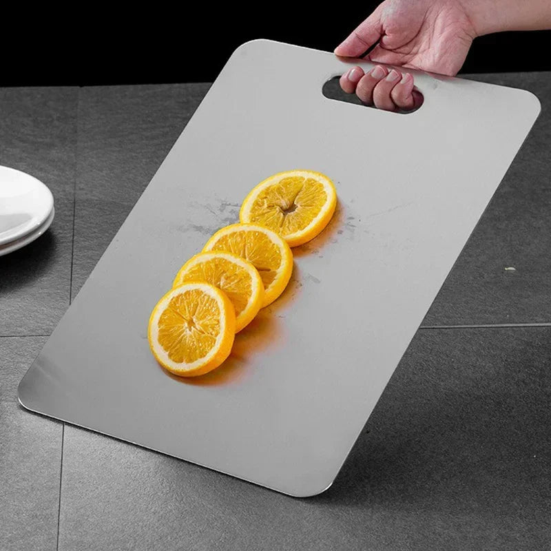 Sleek stainless steel chopping board in a modern kitchen. Ideal for safe and clean food preparation.