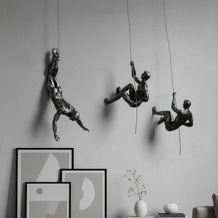 Dynamic climber wall art sculpture, handmade modern home decor figure.