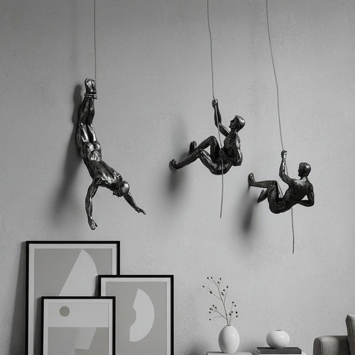 Dynamic climber wall art sculpture, handmade modern home decor figure.
