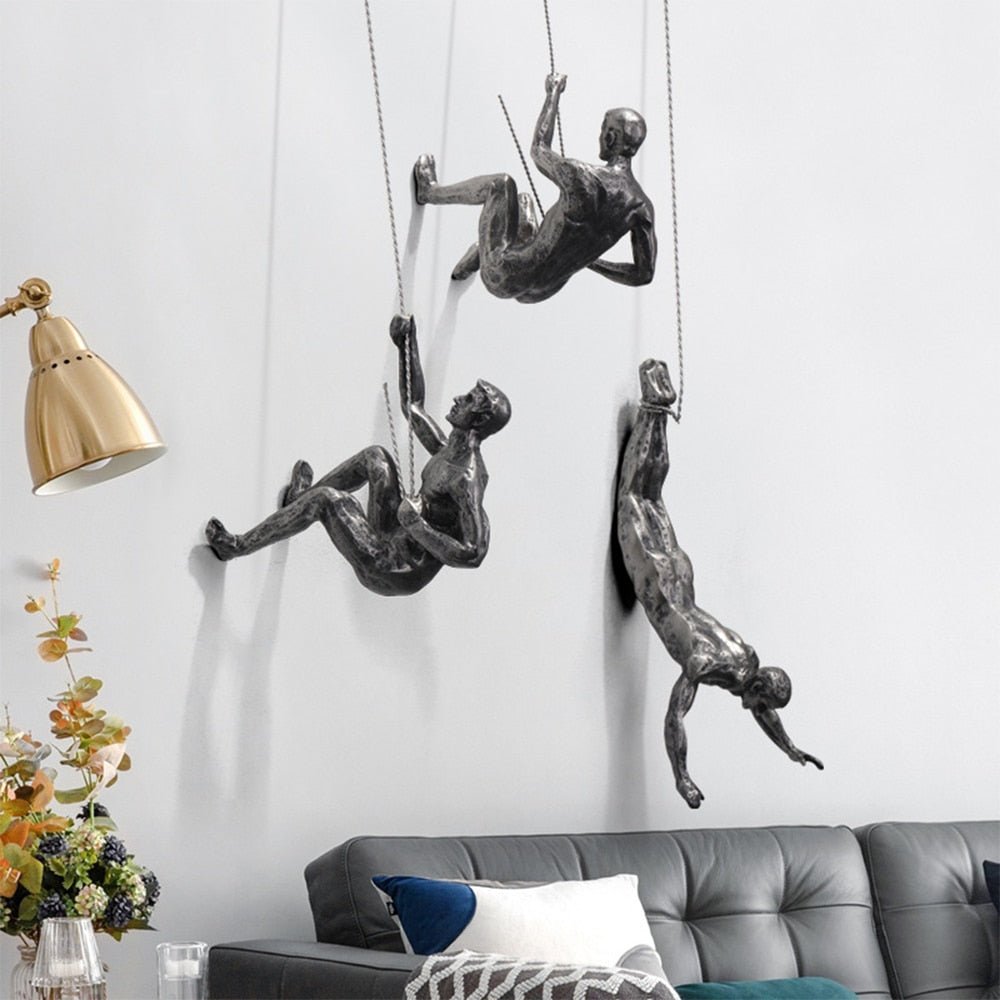 Abstract climbing figure wall sculpture, unique artistic interior design.