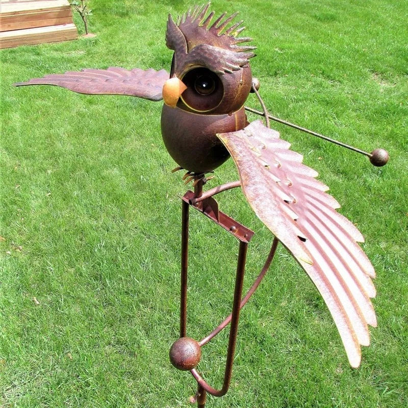 Majestic eagle wind spinner metal garden art. Dynamic outdoor yard ornament for patio decor.