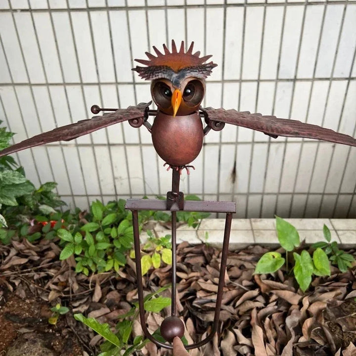 Handcrafted metal bird & owl wind spinner sculpture. Majestic garden art & patio decor.