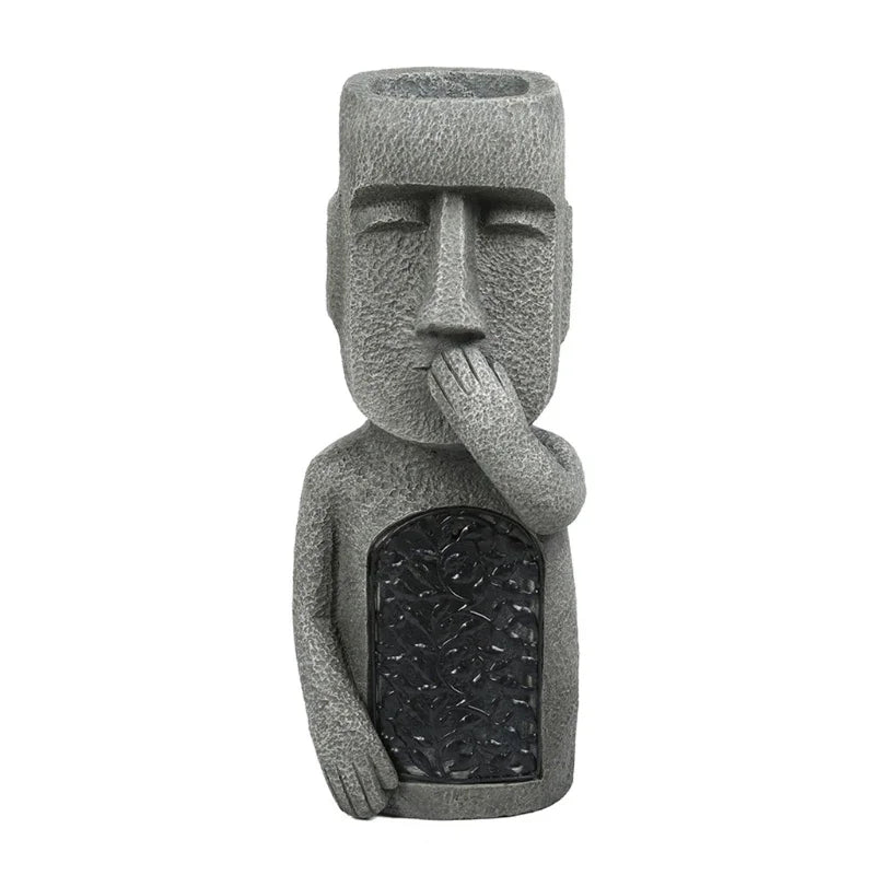 Decorative Moai head planter with LED light, ideal for indoor plants or outdoor patio decor.