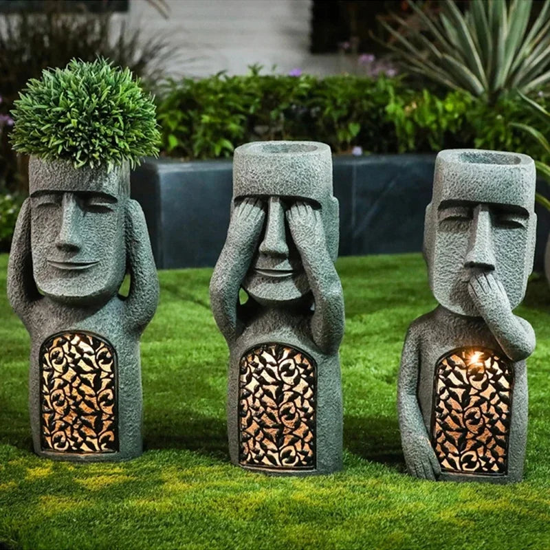 Outdoor Easter Island Moai planter with LED light for succulents, adding a distinctive touch to patios.