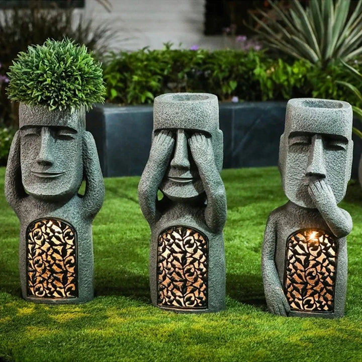 Outdoor Easter Island Moai planter with LED light for succulents, adding a distinctive touch to patios.