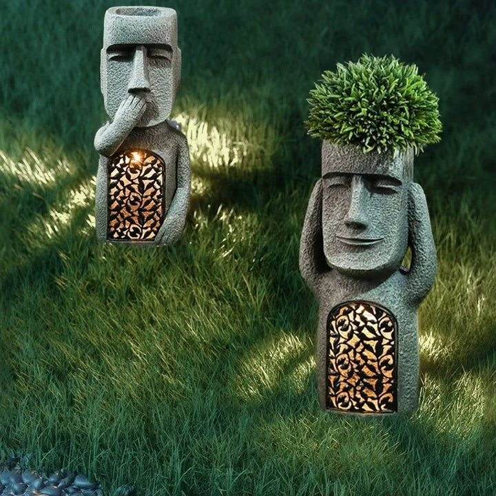 Indoor Moai planter with LED light, an artistic decorative pot for small plants and unique home decor.