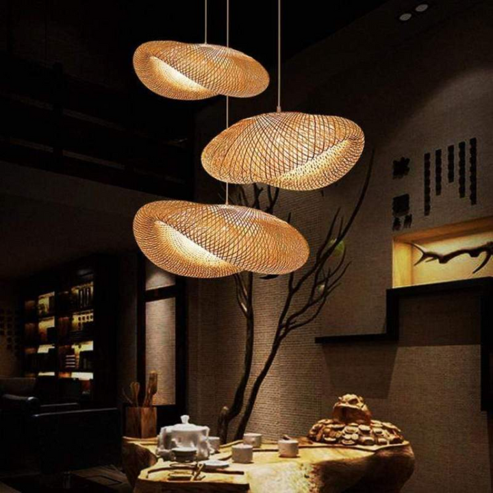 Modern bamboo sphere LED pendant light, warm white glow for cozy dining room ambiance.