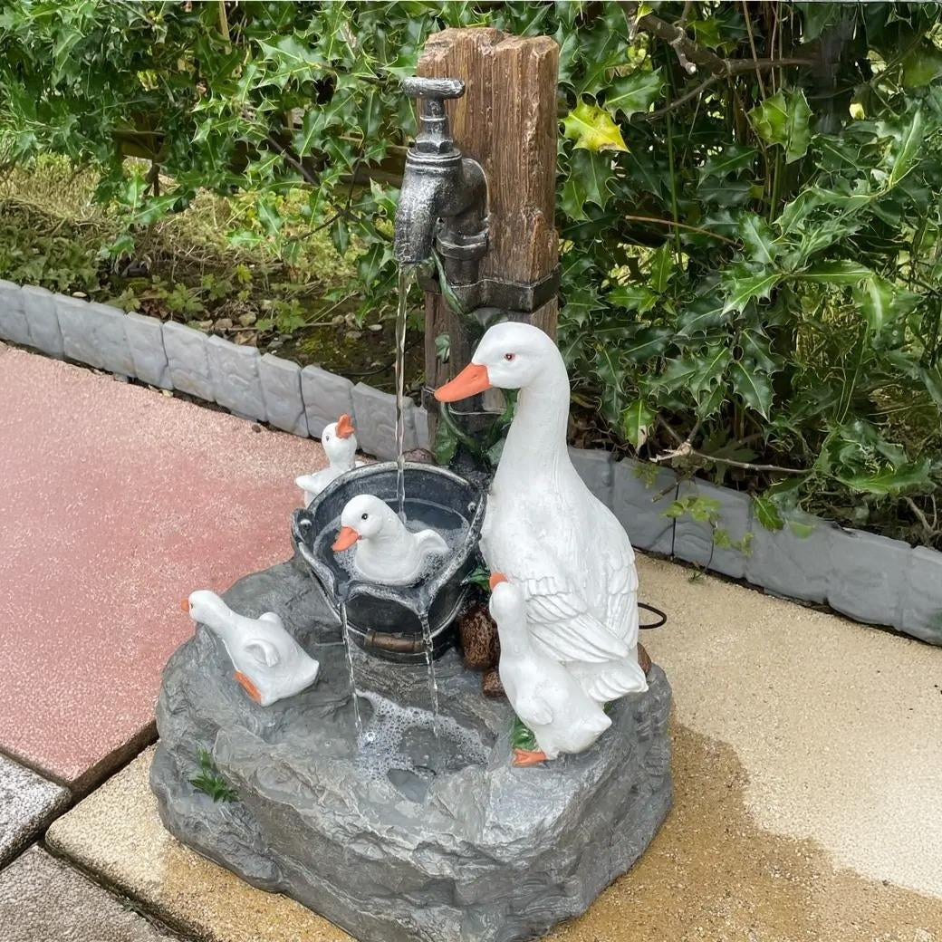 Cordless solar garden fountain with bright LED light & delightful wildlife scene, enhancing patio & outdoor decor.