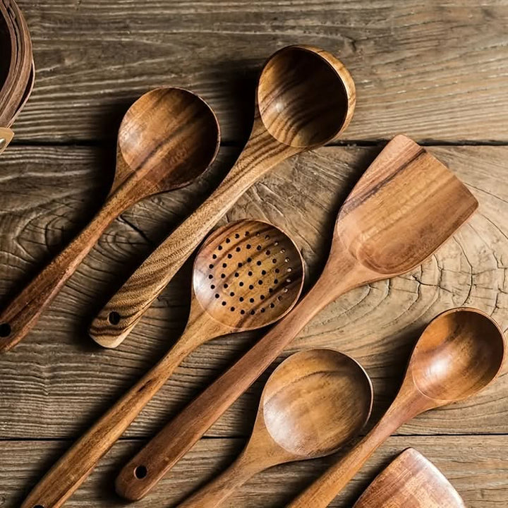 Complete teak kitchen utensil set for cooking. Eco-friendly, sustainable wooden spatulas, spoons, and cooking tools.