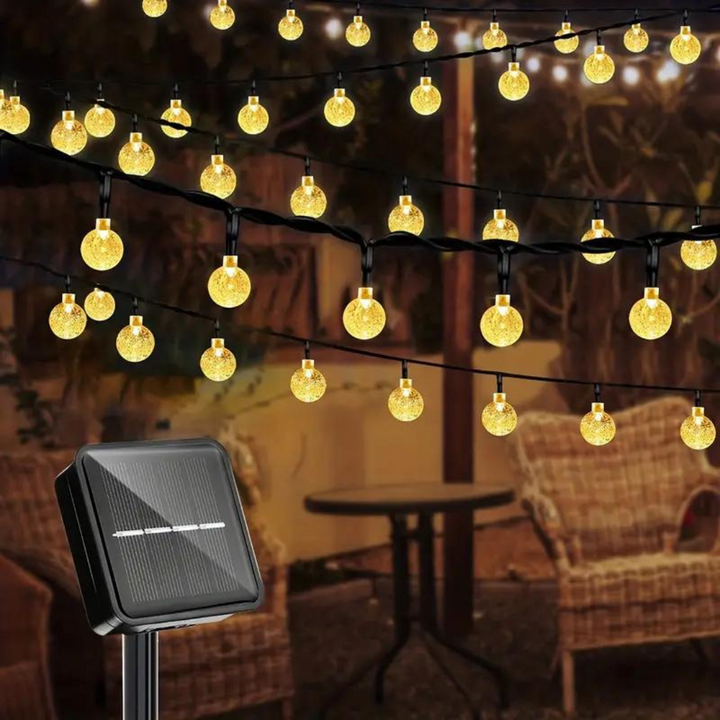 EcoGlow outdoor solar string lights for garden & patio ambiance, waterproof LED warm white glow, eco-friendly.