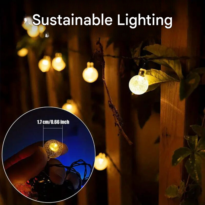 Beautiful solar string lights enhancing garden decor, offering hassle-free outdoor lighting for patio & pathways.