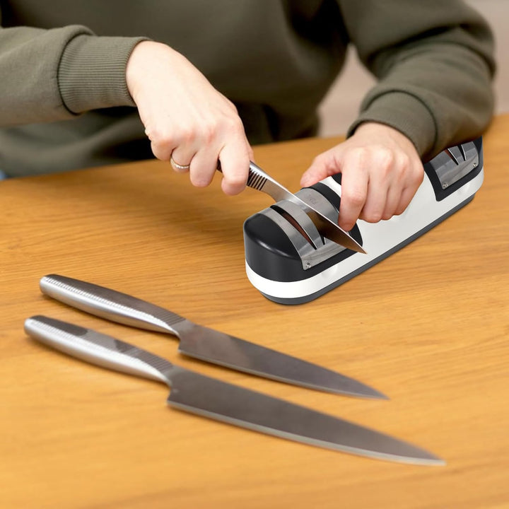 Rechargeable electric knife sharpener, EdgeMaster, displaying speed settings on an LED screen