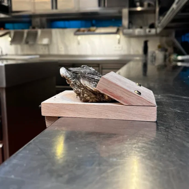 Easy-to-use oyster shucking clamp, designed for quick and safe seafood preparation in any home kitchen.