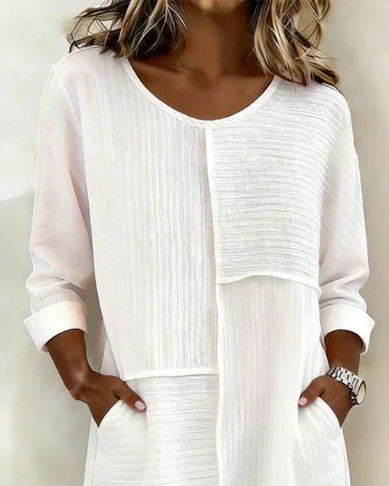 Elegant women's textured shift dress. Modest 3/4 sleeve design, perfect for casual spring & summer fashion.