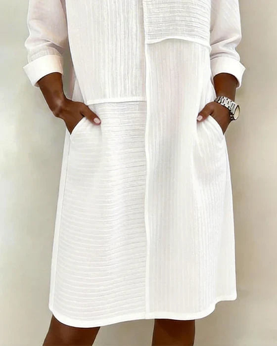 Comfortable women's textured shift dress with pockets. Modest, soft fabric, ideal for elegant everyday wear.
