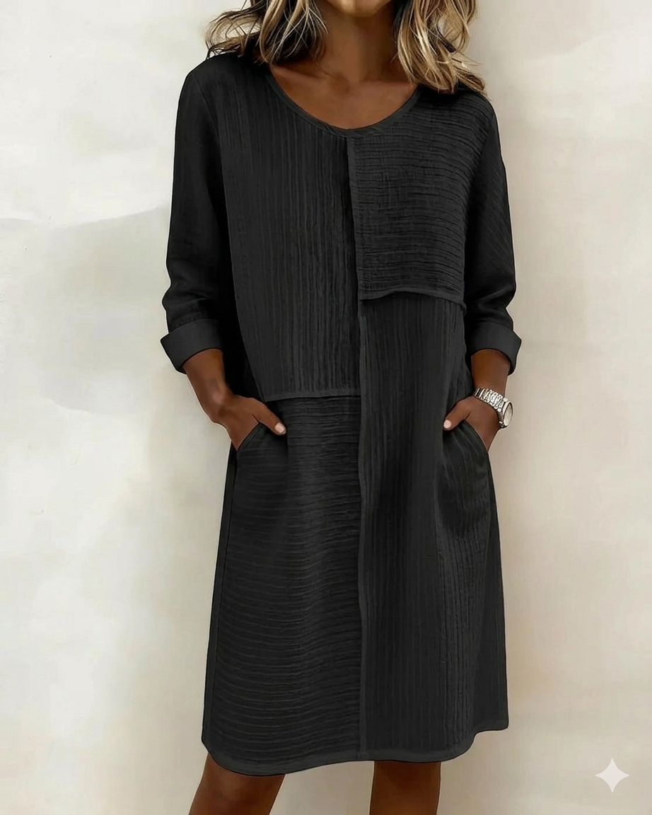 Versatile women's textured shift dress, 3/4 sleeves, pockets. Elegant & comfortable for casual spring/summer fashion.