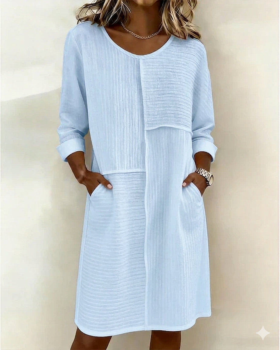 Stylish women's textured shift dress with a relaxed fit. Comfortable, 3/4 sleeves & pockets for effortless everyday wear.