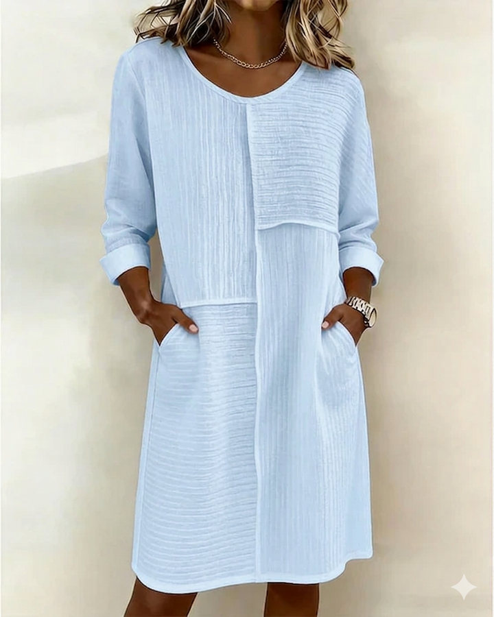 Stylish women's textured shift dress with a relaxed fit. Comfortable, 3/4 sleeves & pockets for effortless everyday wear.