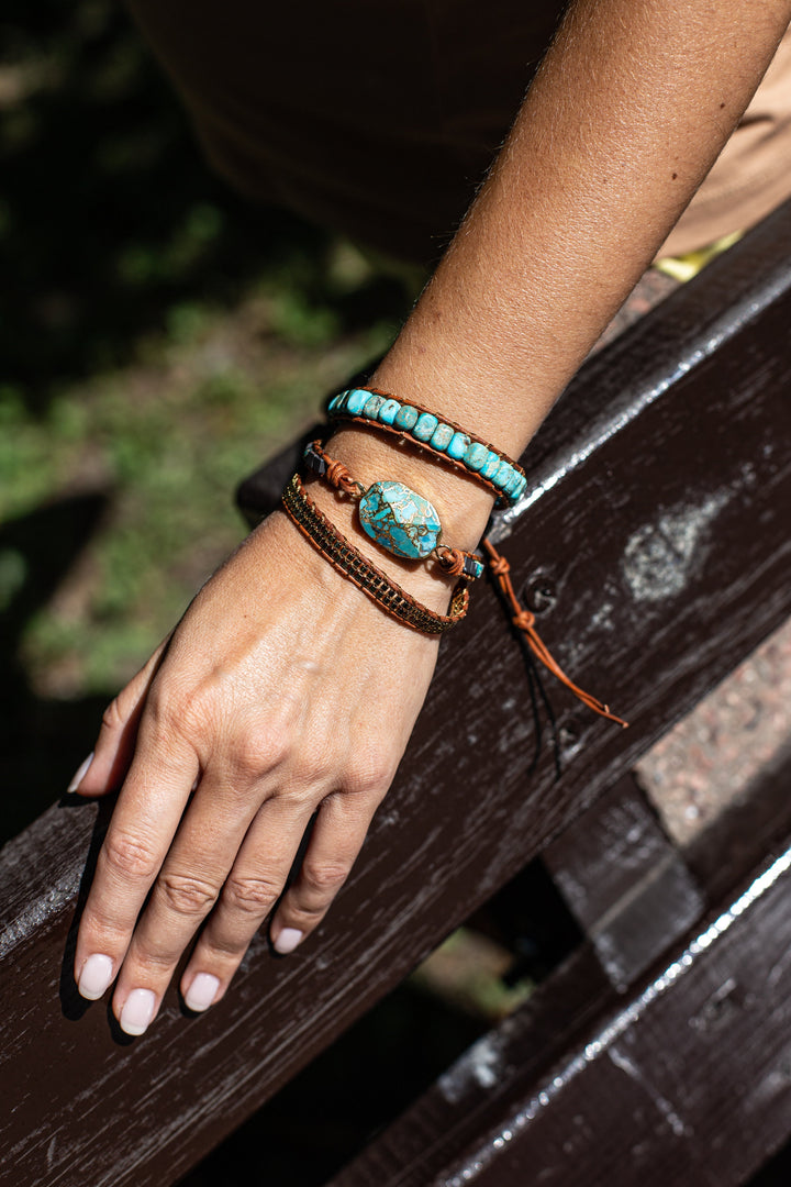 Close-up of turquoise & jasper crystal wrap bracelet, showcasing genuine gemstones and leather