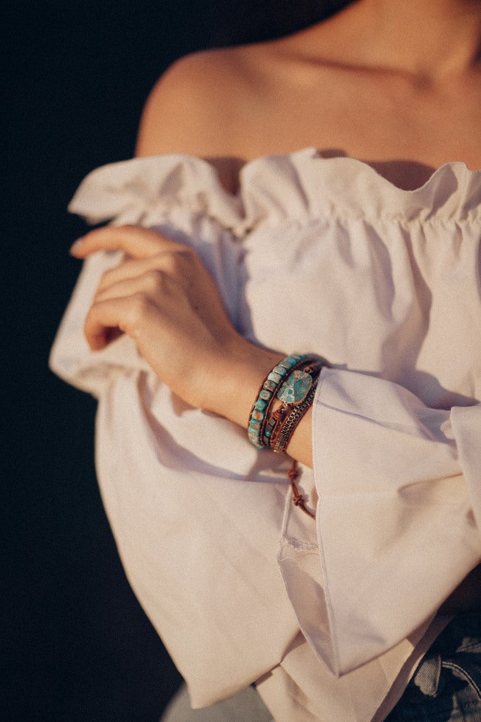 Women's healing energy turquoise & jasper wrap bracelet on wrist, artisanal spiritual jewelry