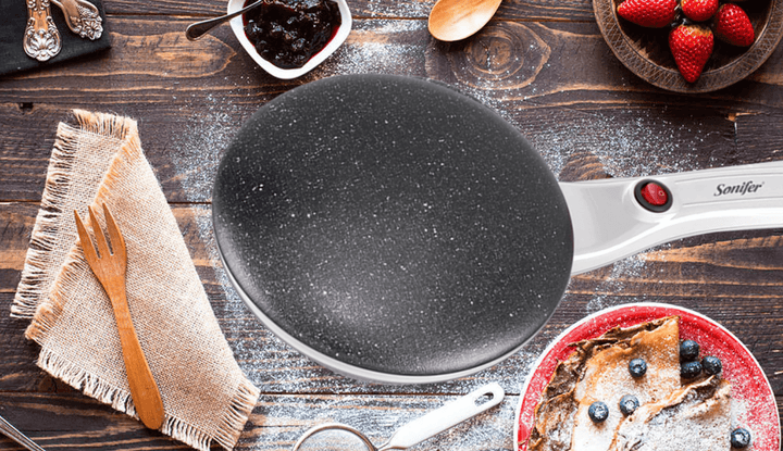 Durable electric crepe griddle with non-stick coating for effortless crepes & easy clean.