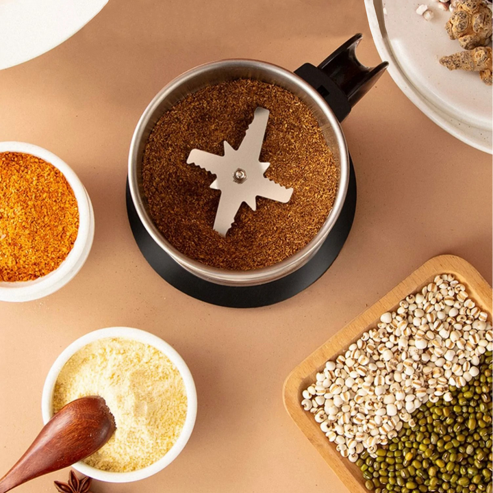 Compact electric food mill, ideal for grinding spices, coffee beans, and grains. Essential kitchen tool.
