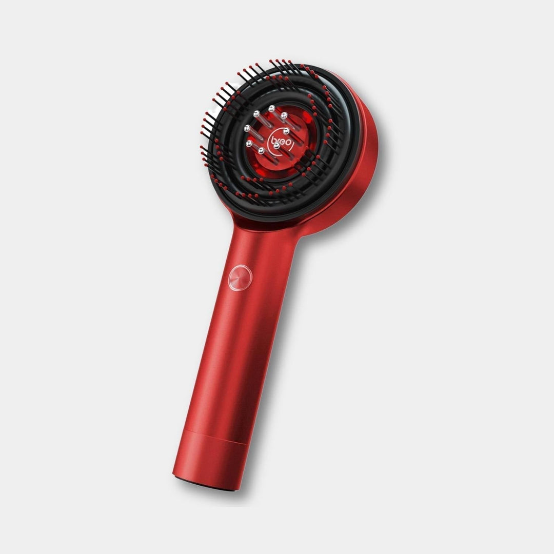 Electric scalp massager brush with LED light therapy for hair growth & relaxation.