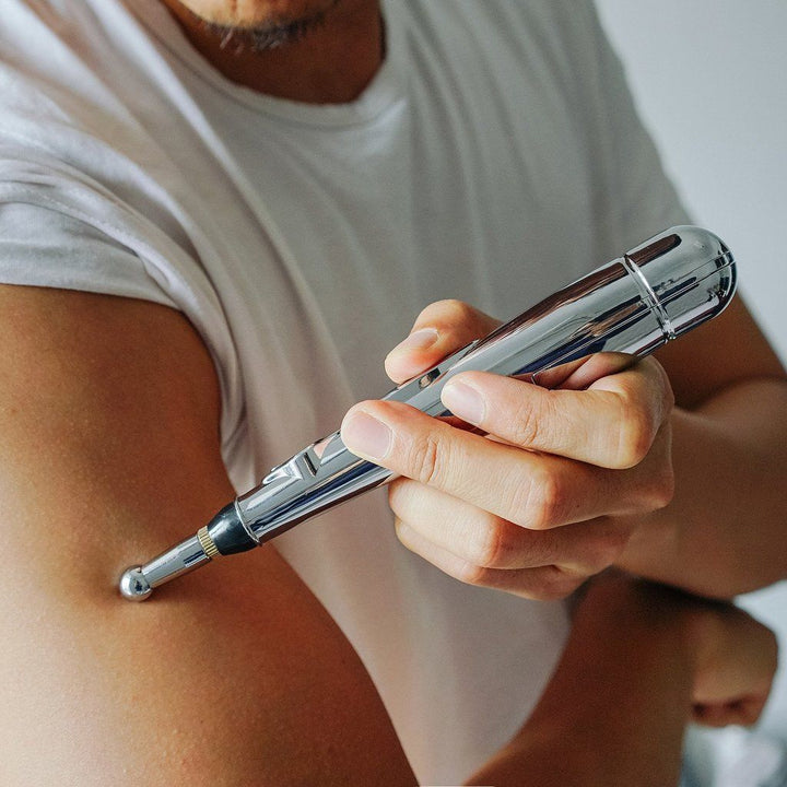 Handheld acupuncture pain relief pen, an electronic massager for muscle and joint comfort. Easy to use.