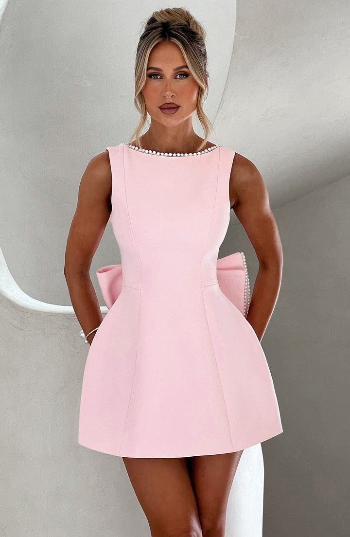 Elegant A-line homecoming mini dress for women with delicate pearl trim and a chic bow accent.