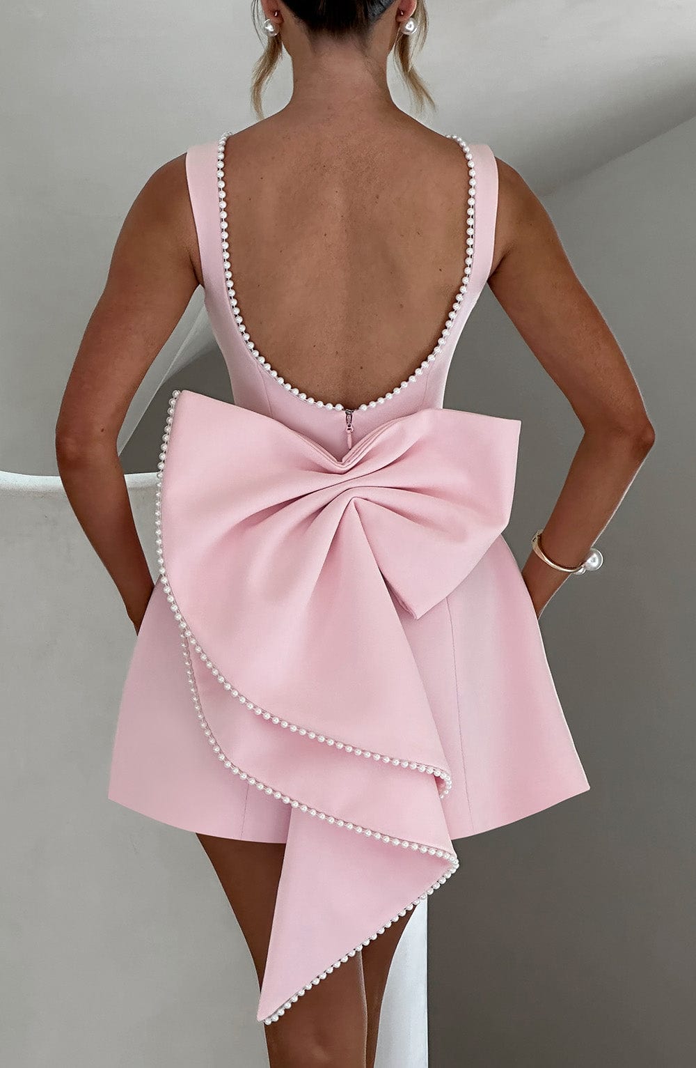 Chic A-line women's mini dress featuring elegant pearl trim, ideal for homecoming or special occasions.