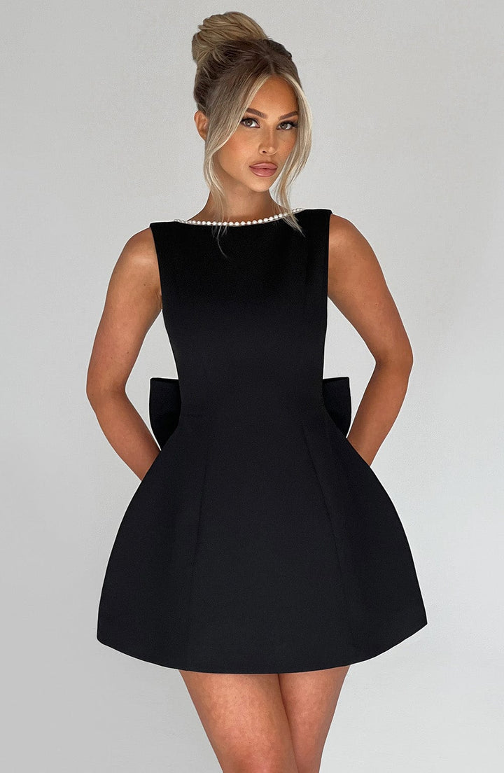 Tailored women's mini homecoming dress with beautiful pearl detailing and a stylish A-line silhouette.