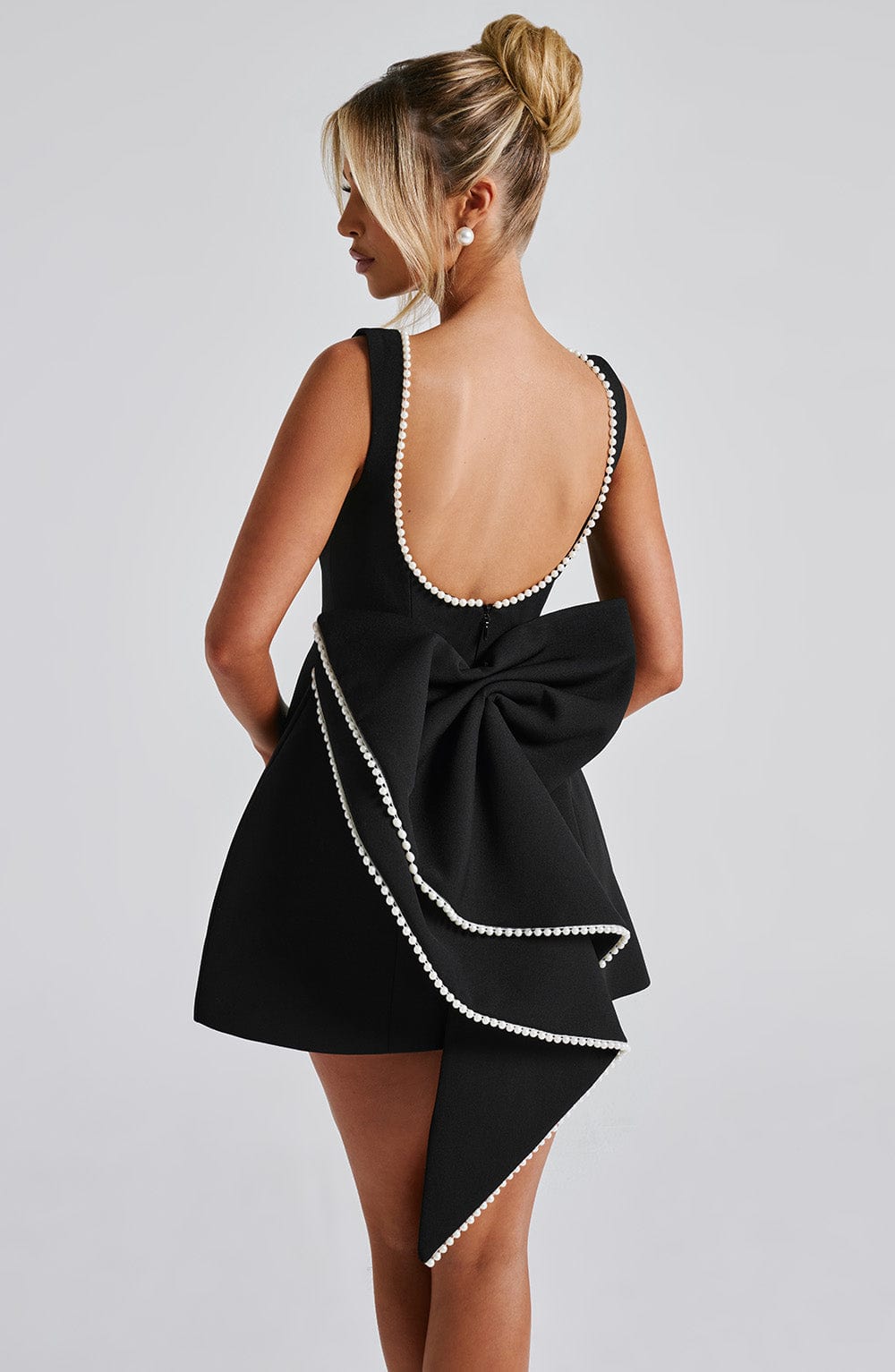 Party-ready women's A-line mini dress, designed with elegant pearl trim for a special occasion.