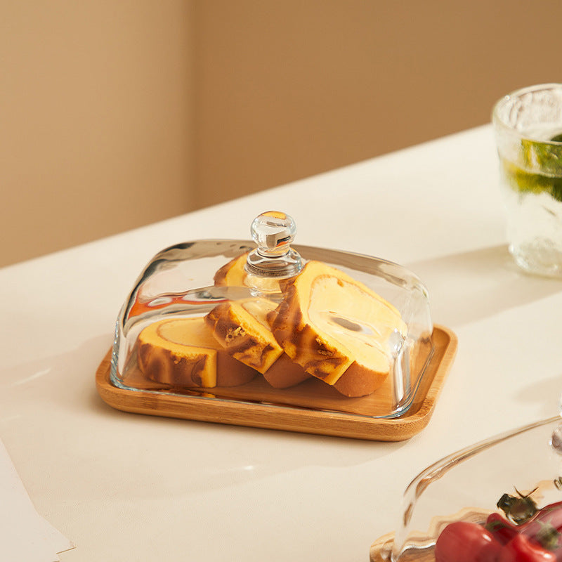 Acacia wood butter dish with glass lid for farmhouse kitchen. A charming & functional kitchen accessory.