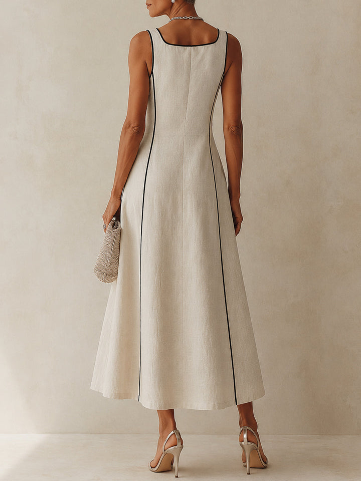 Women's chic apricot sleeveless maxi dress with a square neck, A-line flow, and practical pockets.