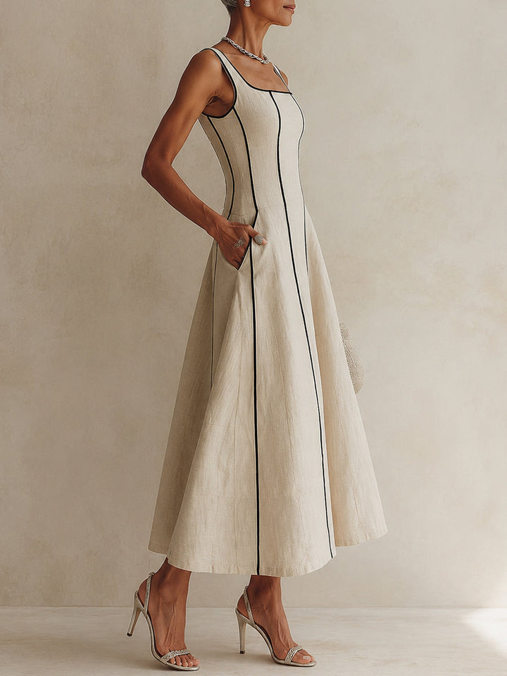 Refined apricot maxi dress with elegant square neck and flowing A-line silhouette, ideal for day-to-night wear.
