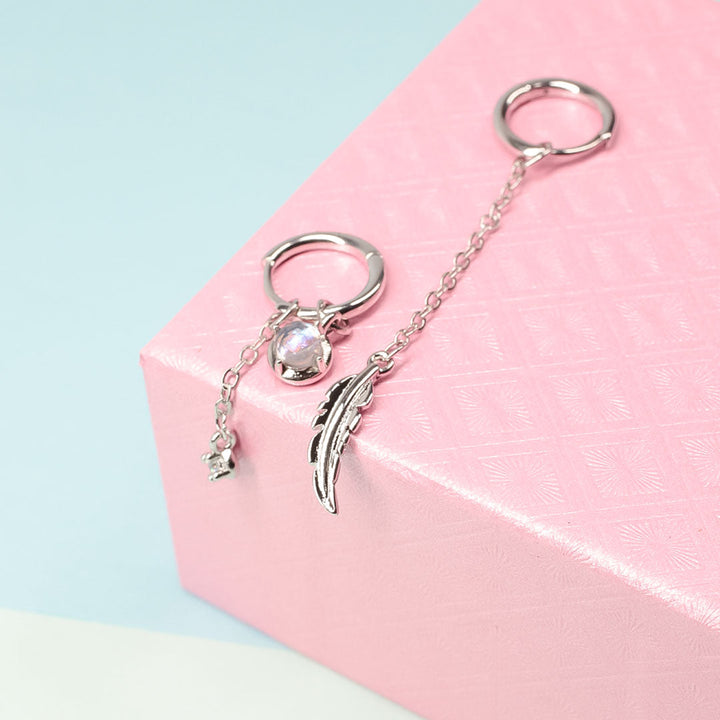 Women's elegant sterling silver feather moonstone drop earrings. Asymmetric unique design.