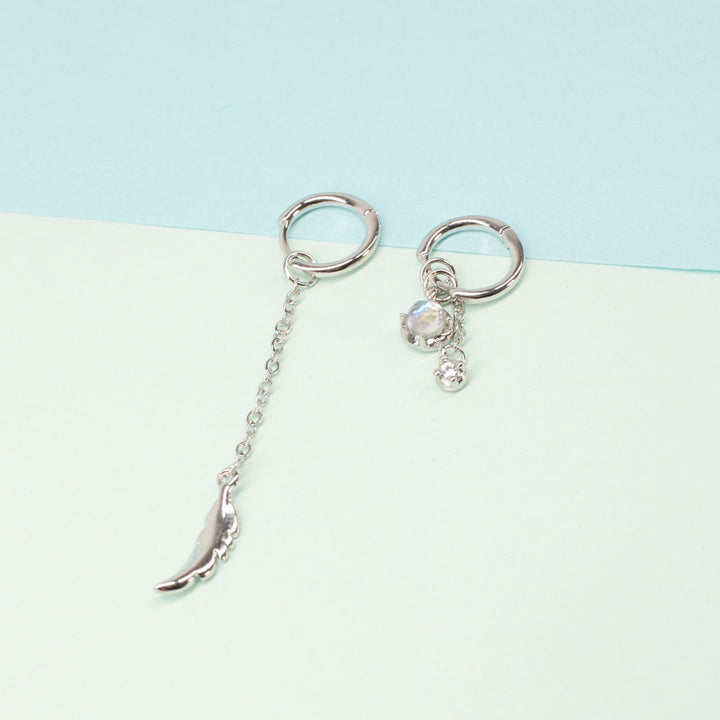 Stylish asymmetric feather moonstone earrings. Sterling silver, elegant women's dangle & drop jewelry.