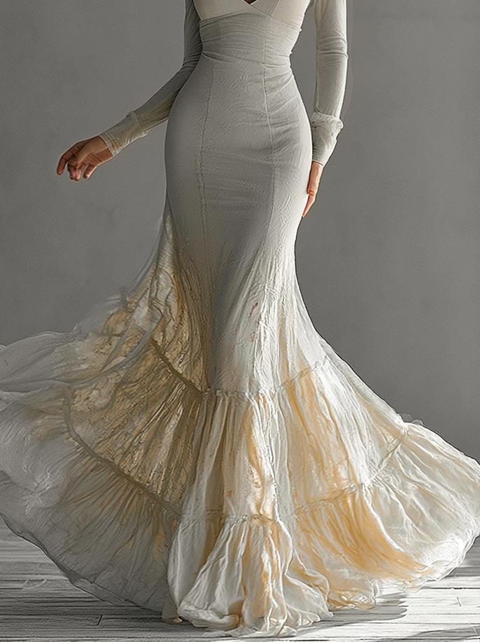 Women's chic beige maxi dress, features deep V-neck, long sleeves & elegant mermaid ruffle. Ideal for gala.