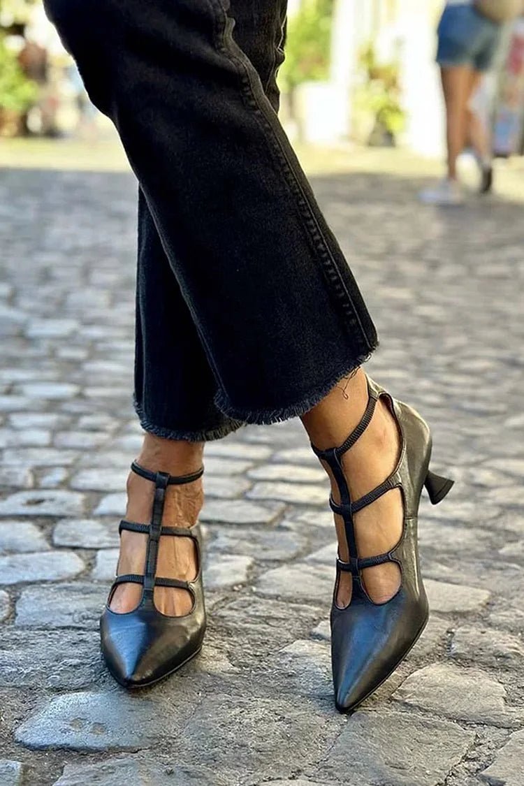 Elegant black cage strap kitten heel pumps for women, pointed toe. Ideal for evening, wedding, or special occasions.