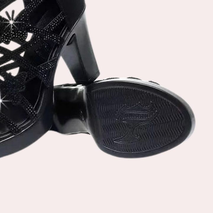 Comfortable women's black heeled sandals. Elegant design, versatile for parties, evening wear, with an adjustable strap.