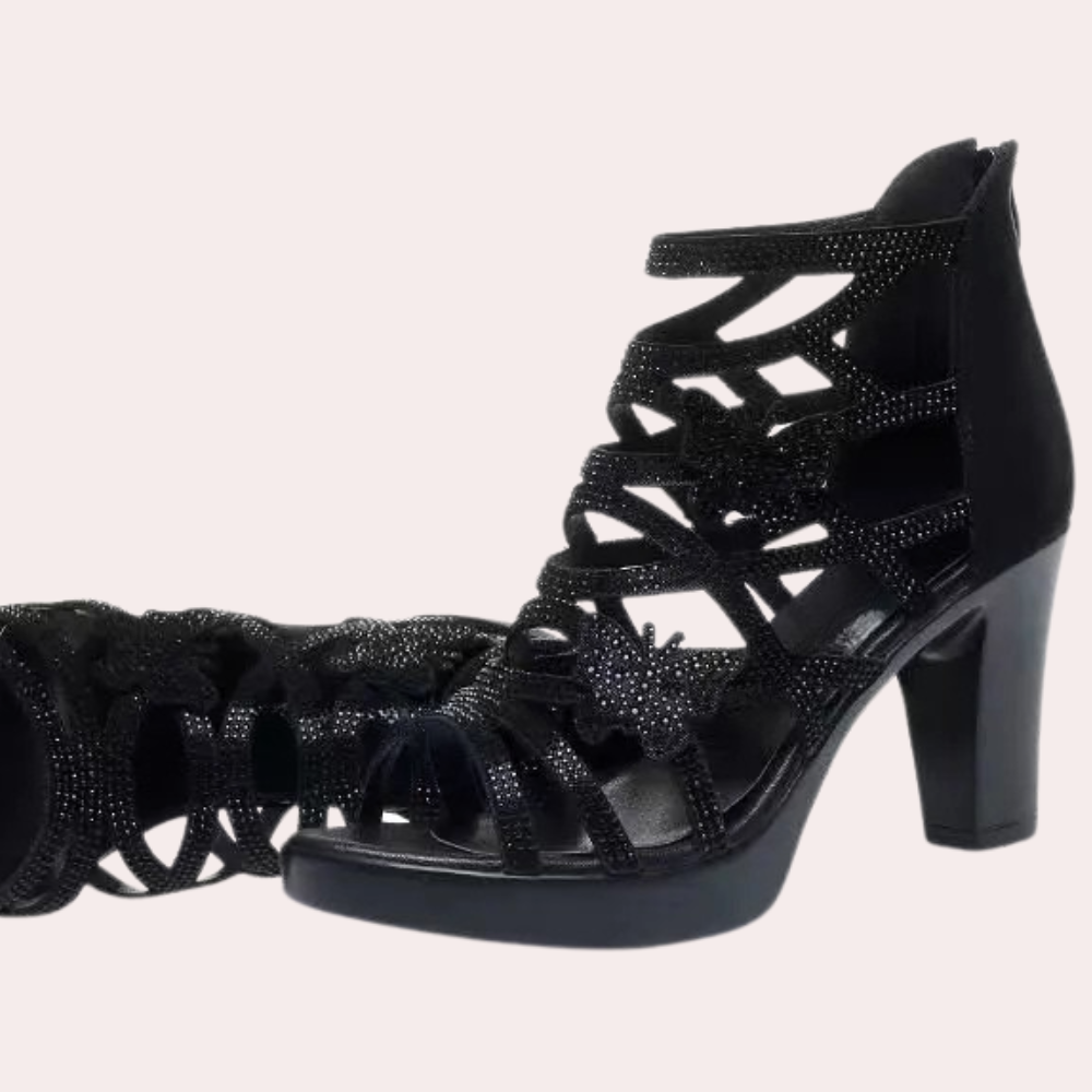Versatile black heeled sandals for women. Elegant, comfortable party shoes with an adjustable strap for a perfect fit.