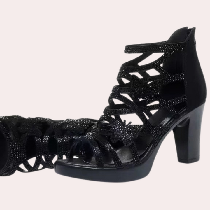 Versatile black heeled sandals for women. Elegant, comfortable party shoes with an adjustable strap for a perfect fit.
