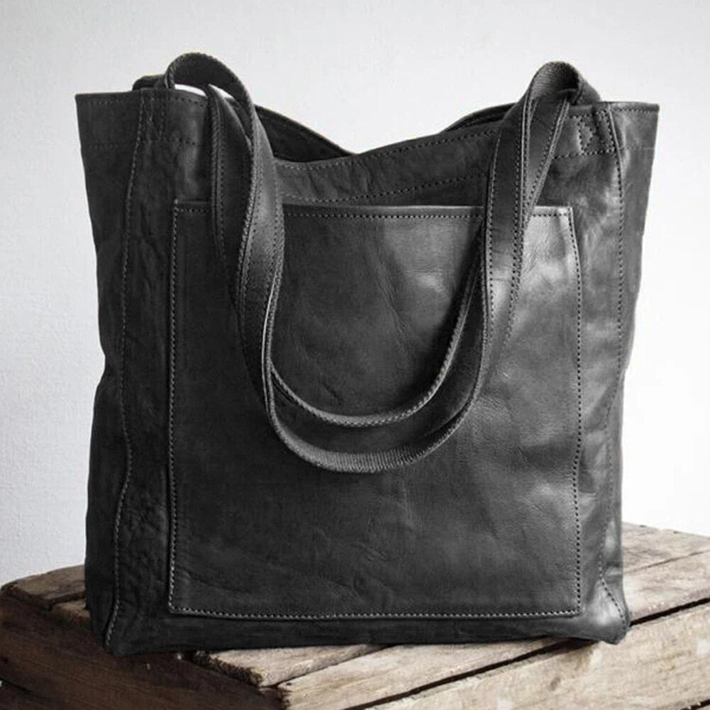 Chic dark brown leather shoulder bag for women. A durable and elegant fashion accessory, ideal for daily use.