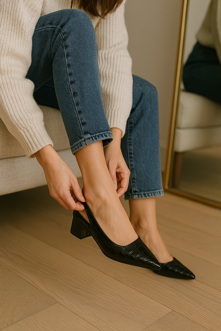 Side view of women's comfortable slingback pumps with a classic block heel design