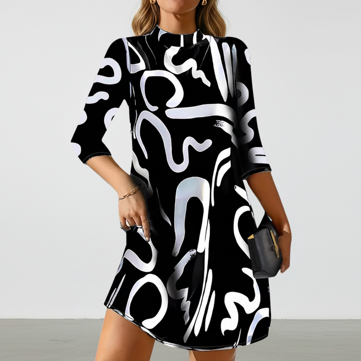 Nina mini dress with long sleeves in black, ideal for versatile officewear